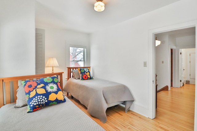 bedroom with hardwood / wood-style floors