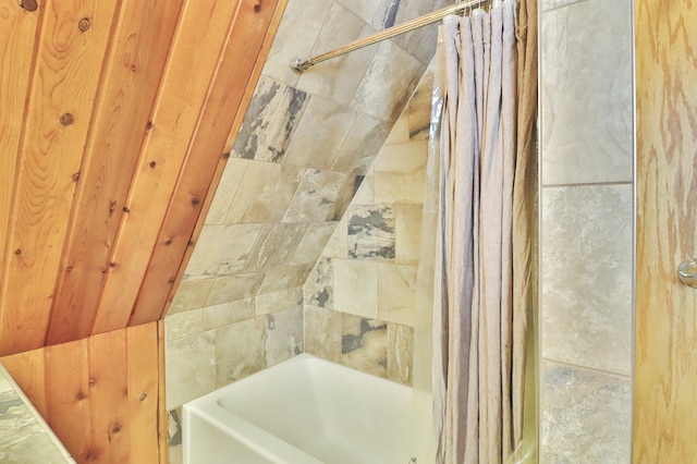 bathroom featuring shower / bath combo with shower curtain