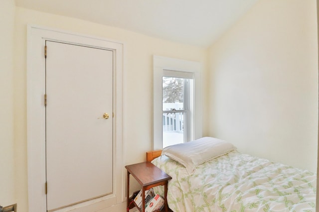 bedroom featuring vaulted ceiling