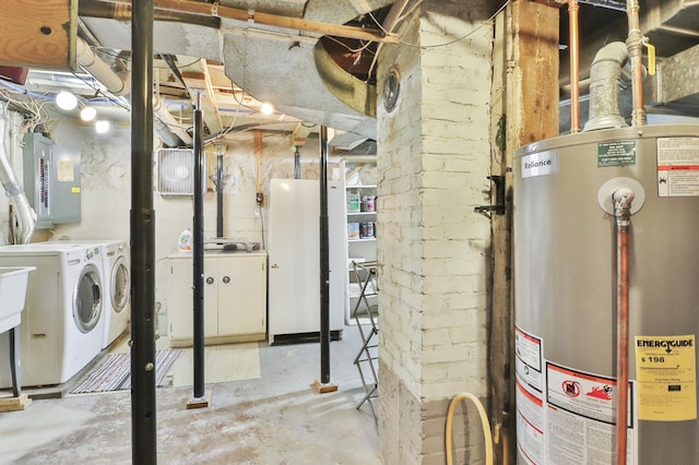 utility room with gas water heater, electric panel, and independent washer and dryer