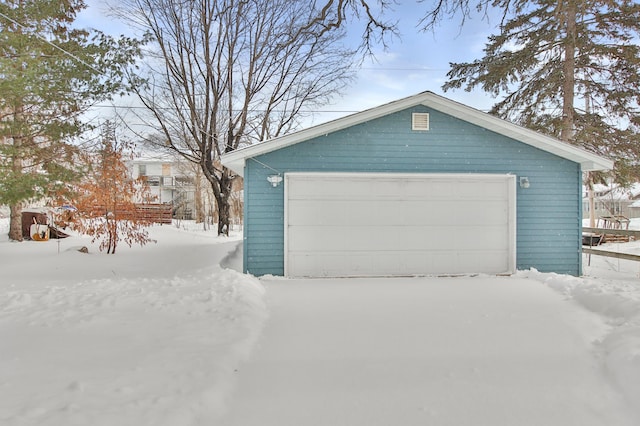 view of snow covered garage