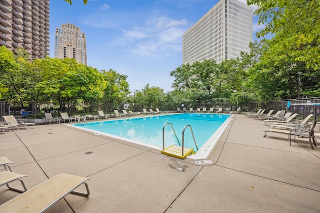 view of swimming pool featuring a patio