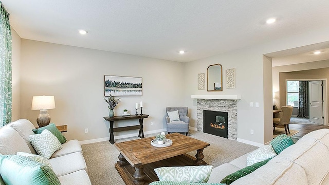 carpeted living room with a fireplace