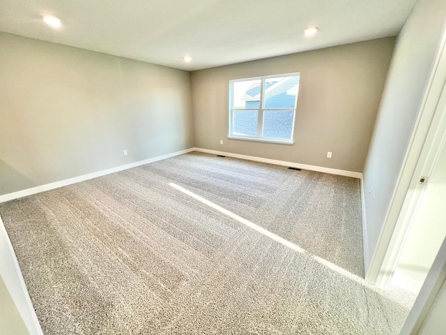 unfurnished room featuring carpet flooring