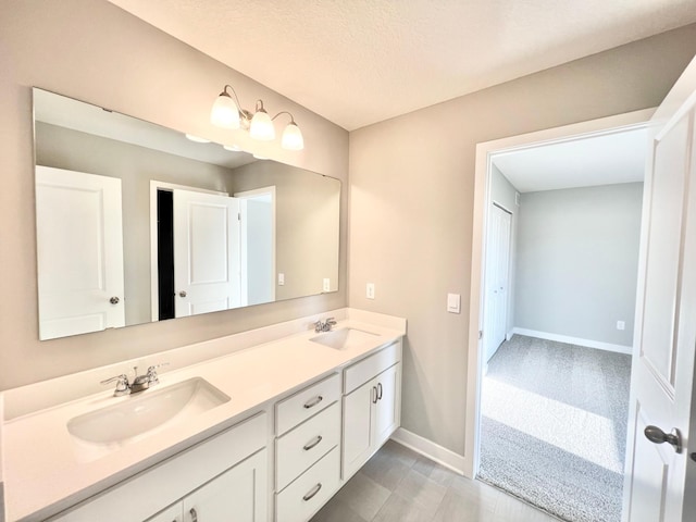 bathroom featuring vanity and a textured ceiling