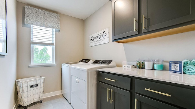 laundry area featuring cabinets and separate washer and dryer