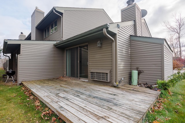 rear view of property with a wooden deck