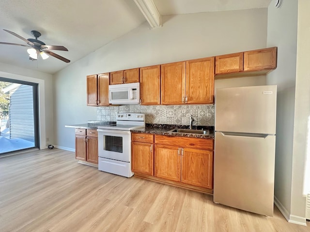 kitchen featuring lofted ceiling with beams, sink, decorative backsplash, light hardwood / wood-style floors, and white appliances