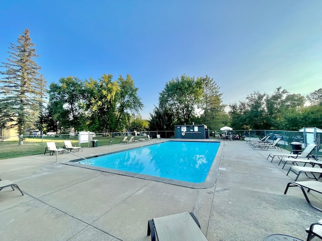 view of swimming pool featuring a patio area