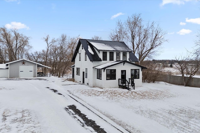 view of front of property with an outbuilding and a garage