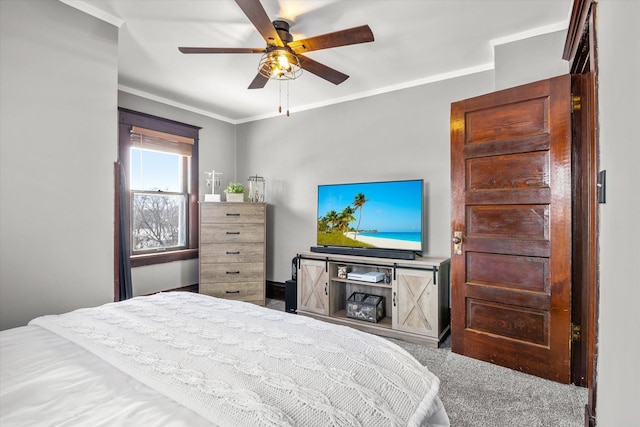 bedroom with ceiling fan and crown molding