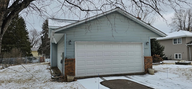 view of snow covered garage