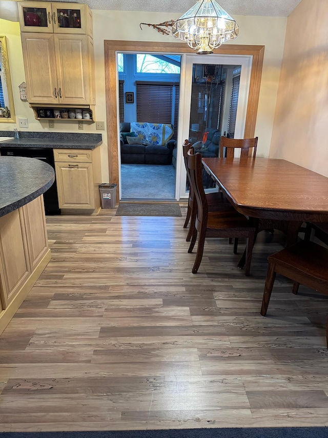 dining room with wood-type flooring and a chandelier