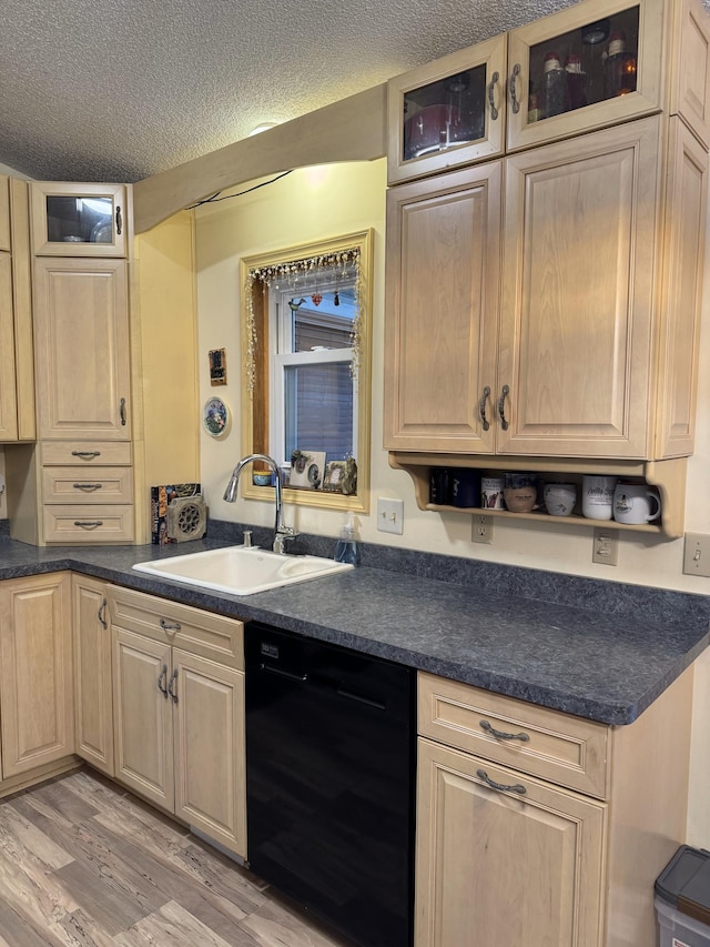 kitchen with sink, a textured ceiling, light brown cabinets, light hardwood / wood-style flooring, and dishwasher