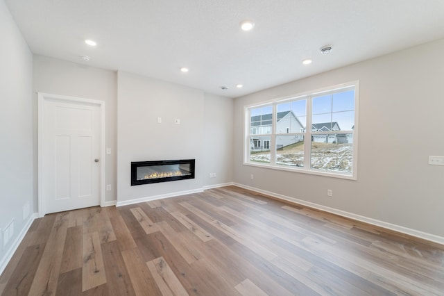 unfurnished living room featuring light hardwood / wood-style flooring