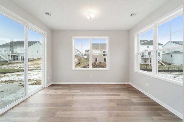 interior space featuring light hardwood / wood-style flooring and a wealth of natural light