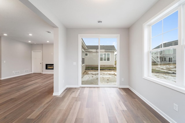 empty room with hardwood / wood-style floors