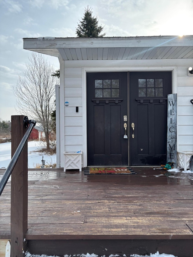 view of snow covered property entrance