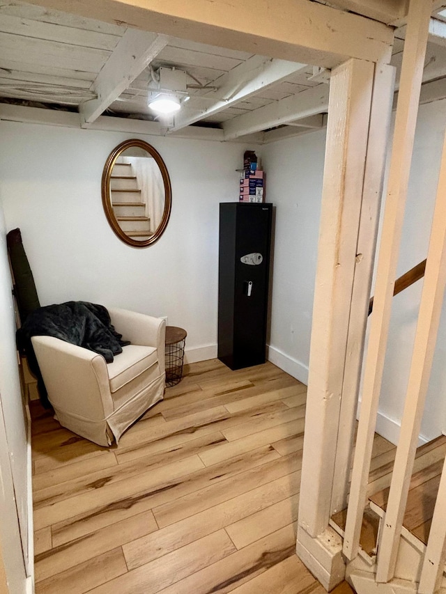 living area with hardwood / wood-style flooring