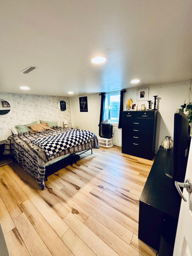 bedroom featuring hardwood / wood-style floors