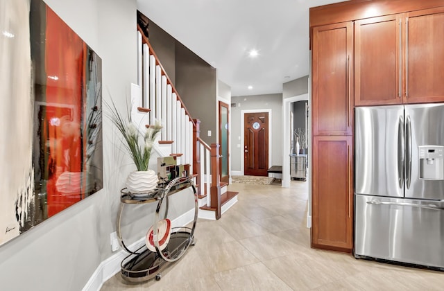 kitchen with light tile patterned floors and stainless steel fridge with ice dispenser