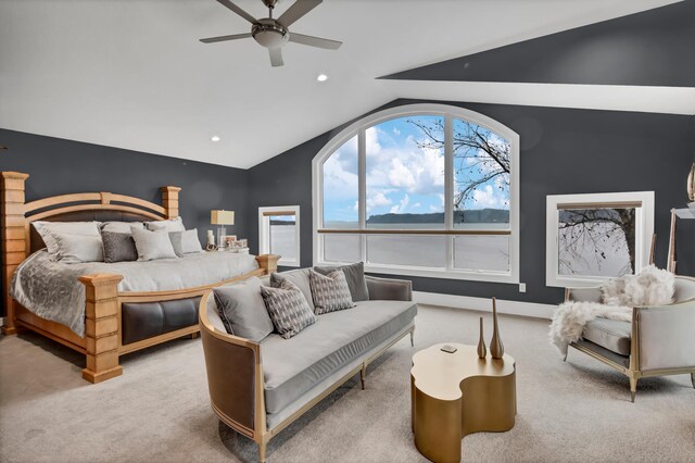 carpeted bedroom with vaulted ceiling and ceiling fan