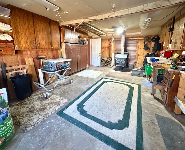 interior space featuring a workshop area and a wood stove