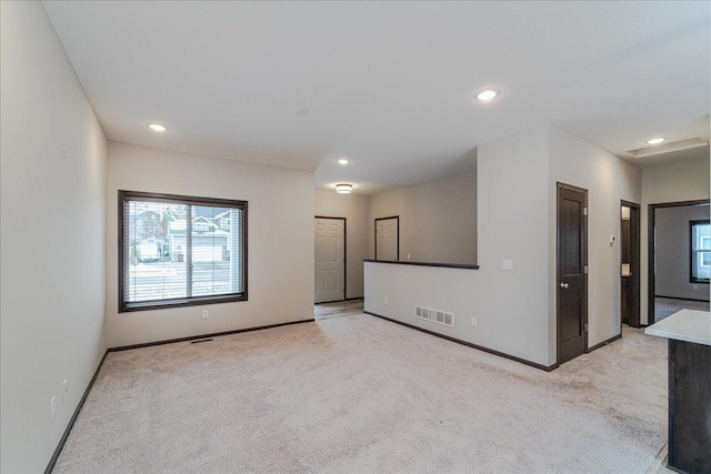 carpeted spare room with plenty of natural light