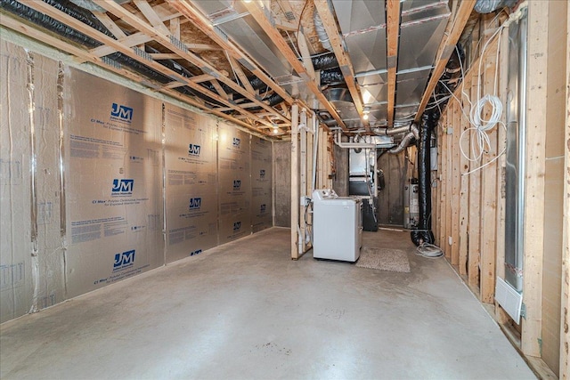 basement featuring washer / dryer and gas water heater