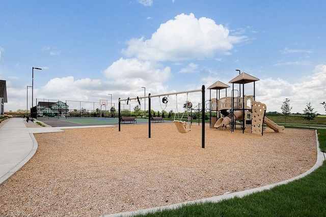 community jungle gym featuring community basketball court and fence