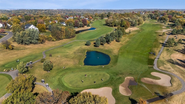 aerial view with a water view and golf course view