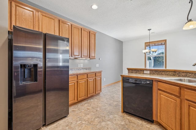 kitchen with dishwasher, sink, stainless steel fridge, and decorative light fixtures