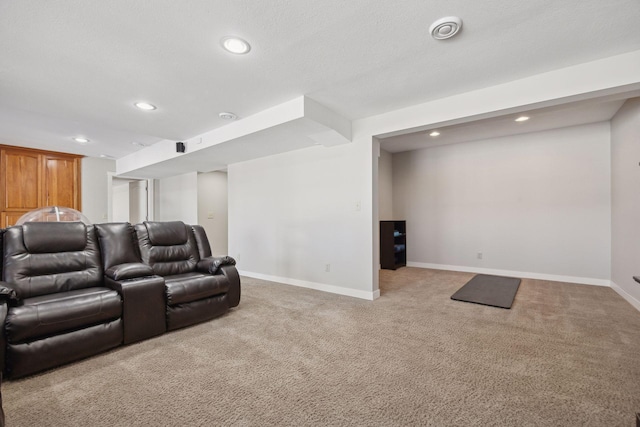 home theater room with a textured ceiling, recessed lighting, carpet, and baseboards