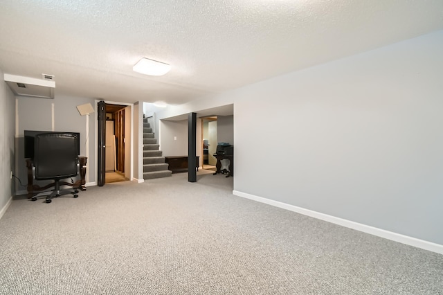 basement with carpet floors and a textured ceiling