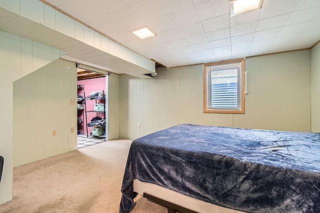 carpeted bedroom featuring a walk in closet