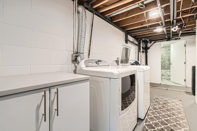 laundry room with independent washer and dryer