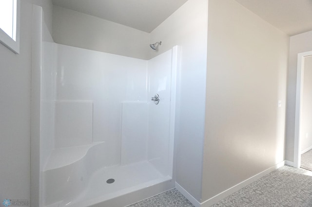 bathroom featuring walk in shower