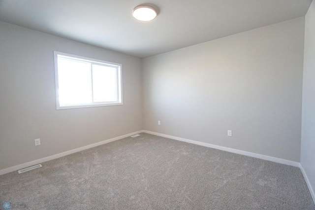 spare room featuring carpet