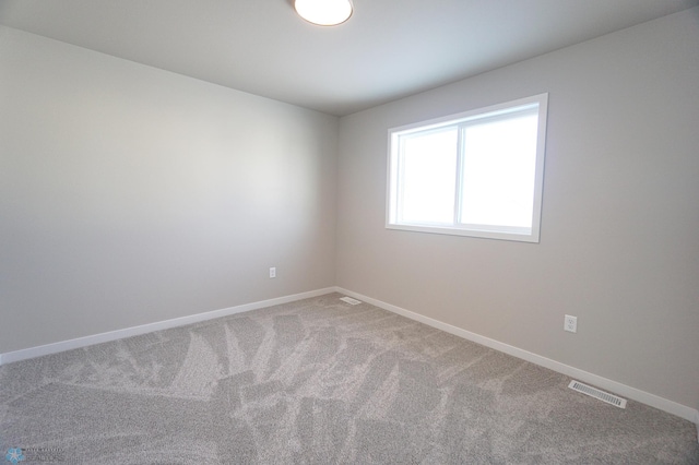 empty room with carpet flooring