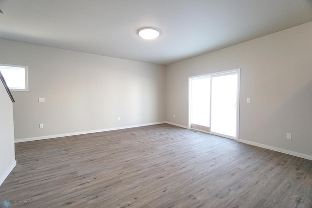 6020 80th Ave S, Fargo, ND 58047 - empty room featuring wood finished floors and baseboards