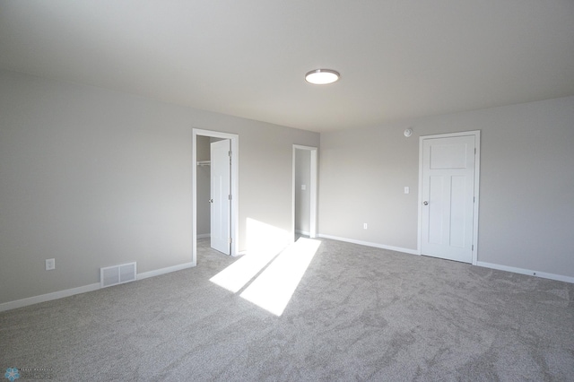 6020 80th Ave S, Fargo, ND 58047 - unfurnished bedroom with carpet flooring, baseboards, a walk in closet, and a closet