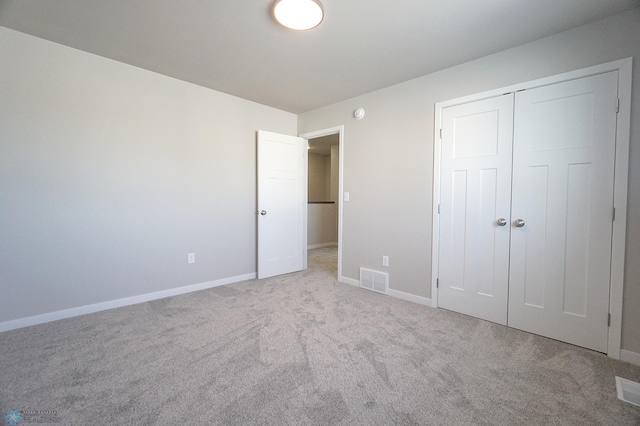 6020 80th Ave S, Fargo, ND 58047 - unfurnished bedroom featuring carpet, baseboards, and a closet