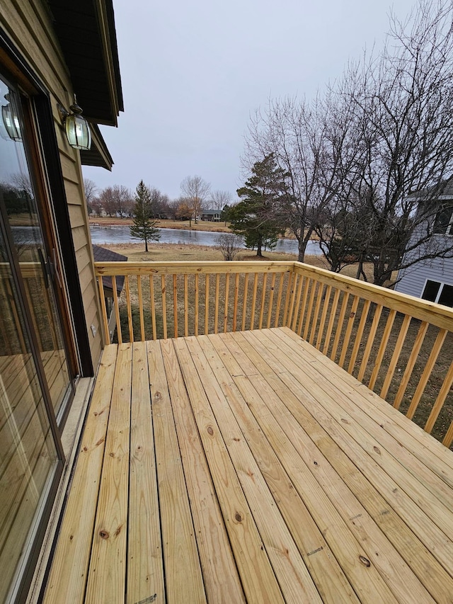 wooden deck with a water view