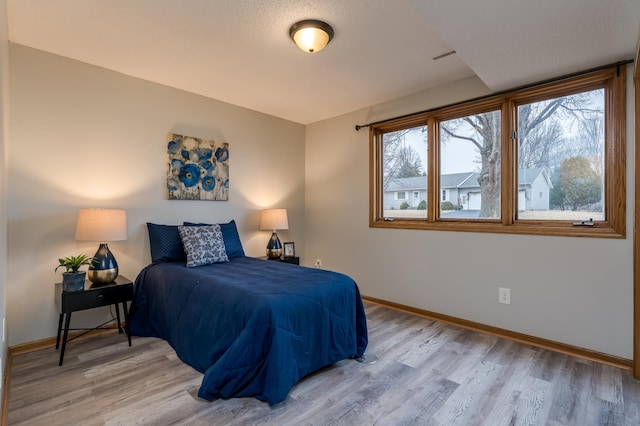 bedroom featuring hardwood / wood-style floors