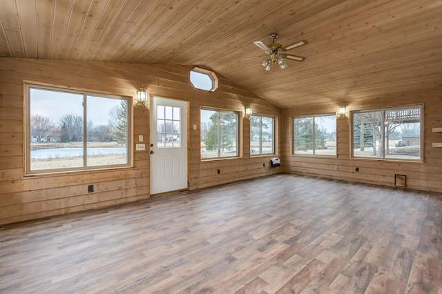 unfurnished sunroom with lofted ceiling, a water view, wooden ceiling, and ceiling fan