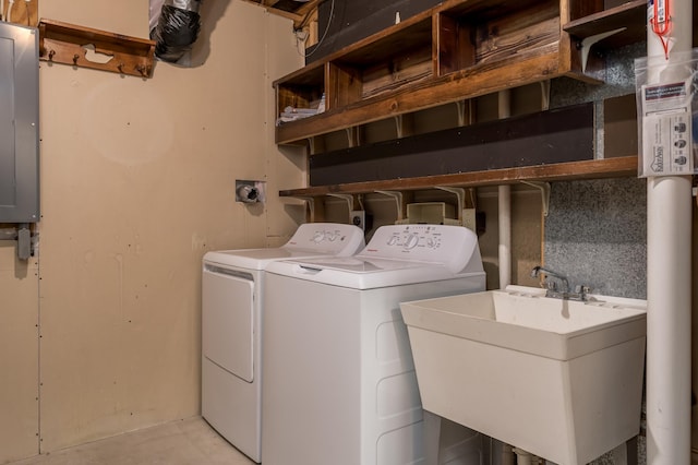 washroom with washer and dryer, sink, and electric panel