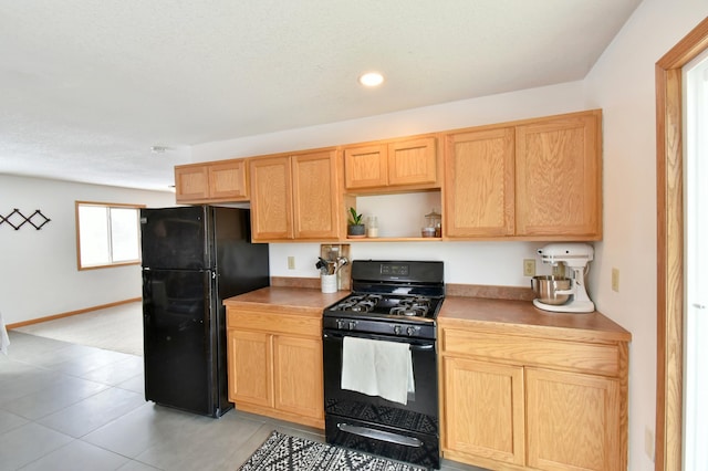 kitchen featuring light countertops, black appliances, light brown cabinets, open shelves, and recessed lighting