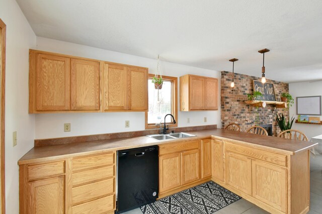 kitchen featuring a peninsula, a sink, light countertops, dishwasher, and decorative light fixtures