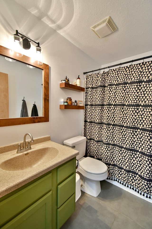 full bathroom with visible vents, toilet, tile patterned flooring, a textured ceiling, and vanity