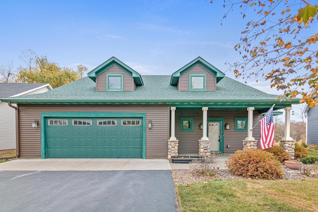 view of front of property with a garage and covered porch